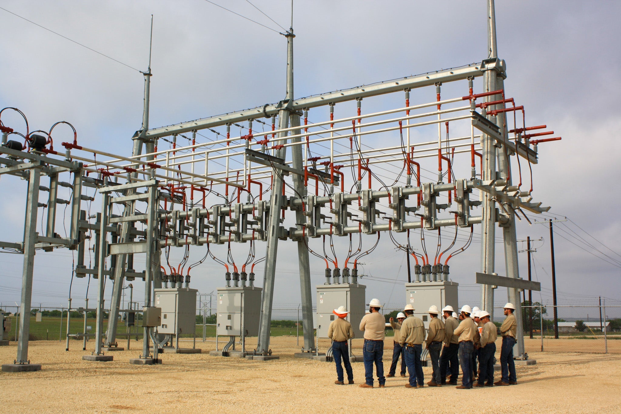 Employees training at de-energized substation.